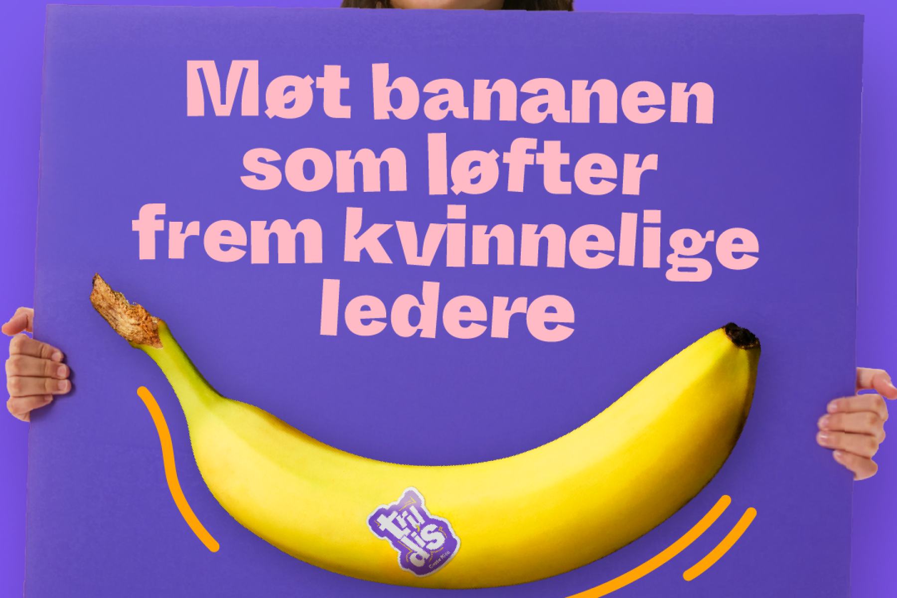 Kind hat Schild mit Banane in der Hand