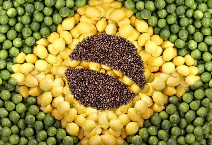 Brasilianische Flagge aus Lebensmitteln: grüne Erbsen, gelbe Zitronen und braune Kaffeebohnen in Form des Landeswappens