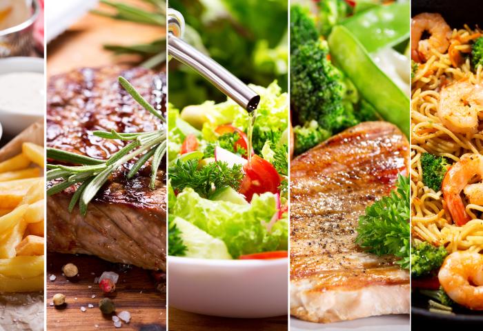Eine Reihe von acht Gerichten, darunter Pommes frites, Steak, Salat, Pasta mit Garnelen, Tacos, gegrillter Fisch und ein Dessert in einer Schüssel. Jedes Gericht ist ansprechend angerichtet.