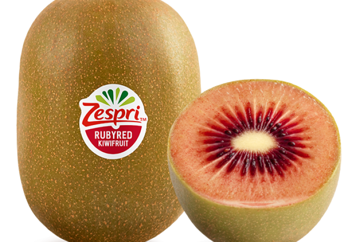 ganze und halbierte rote Kiwi